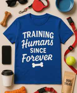 Training Humans T-shirt for dog lovers, funny pet owner gift, casual wear for animal enthusiasts.