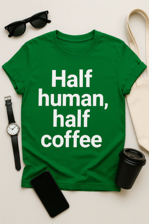 Green T-shirt with humorous "Half human, half coffee" slogan for coffee lovers and casual wear.