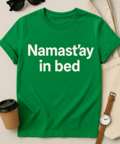 Relaxed fit green T-shirt with "Namastay in bed" slogan, perfect for casual wear and comfort.