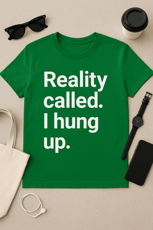 Black sunglasses and a coffee cup on a beige background, featuring a green T-shirt with humorous "Reality called. I hung up." slogan.