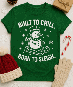 1. Festive green T-shirt with snowman and holiday slogan, perfect for Christmas.