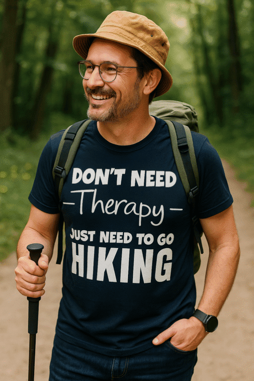 1. Man wearing outdoor hiking T-shirt with funny quote in nature setting.