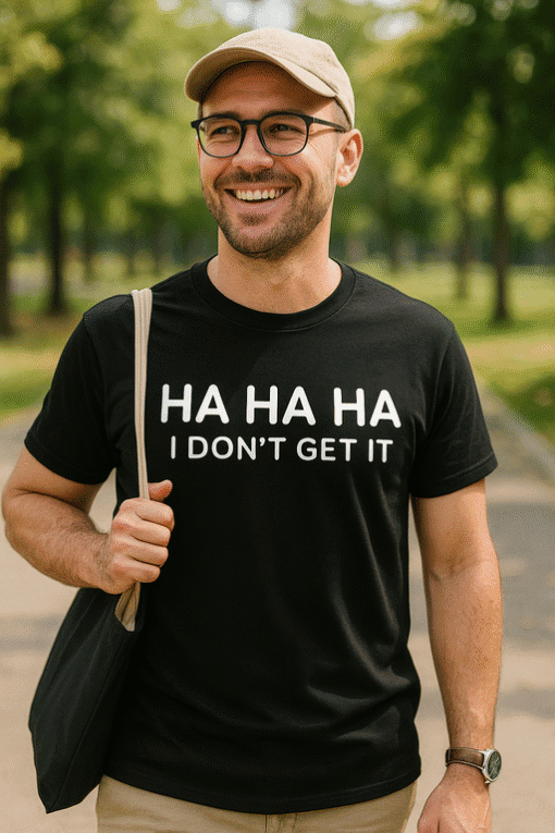 1. Man smiling in casual t-shirt with humorous text outdoors.