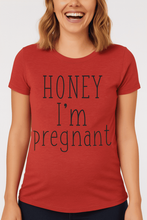 Pregnant woman wearing humorous "Honey I'm pregnant" T-shirt, perfect for maternity and pregnancy announcement.