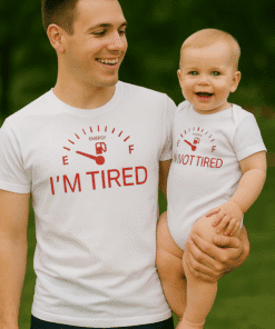 Worn matching "I'm Tired" t-shirts with a fuel gauge design, perfect for family humor and casual wear.