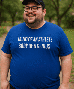 - Enthusiastic man wearing a blue T-shirt with motivational quote outdoors.