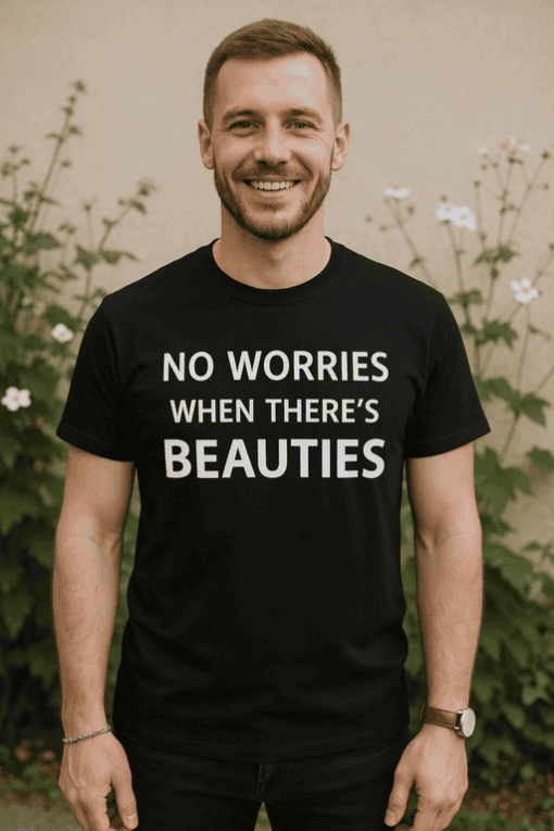 Happy man wearing black T-shirt with inspirational quote outdoors.