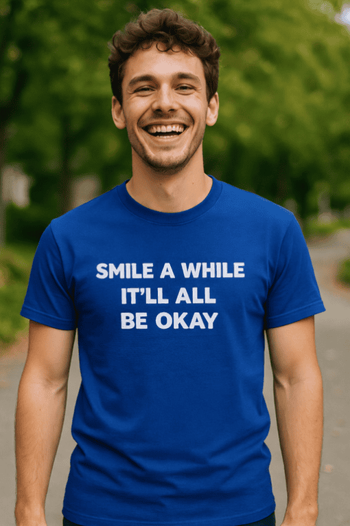 Happy man smiling wearing blue T-shirt with inspirational quote outdoors.