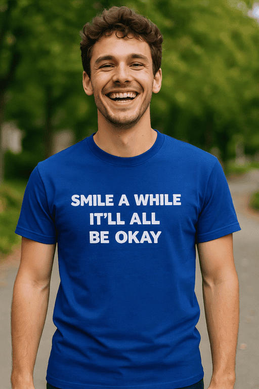 Happy man smiling wearing blue T-shirt with inspirational quote outdoors.