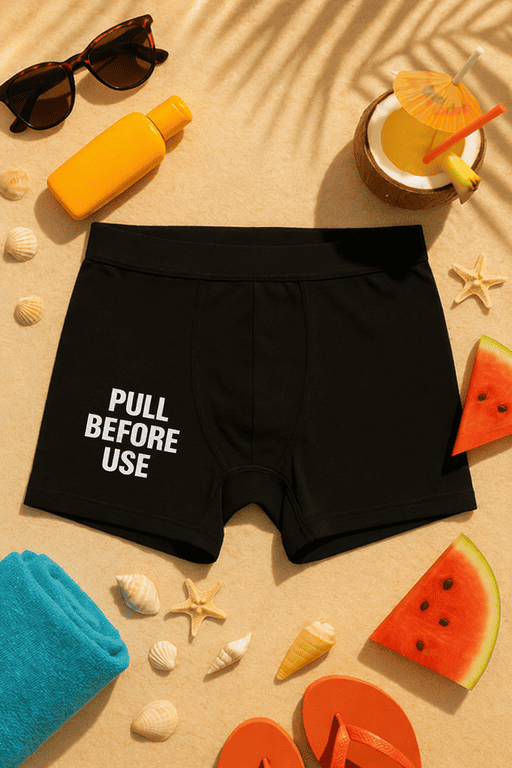 Pull before use black men's boxer briefs with humorous white text.
