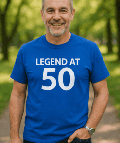 1. Happy senior man wearing "Legend at 50" birthday T-shirt outdoor in park.