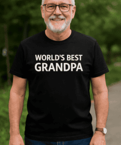 Happy grandpa wearing "World's Best Grandpa" T-shirt outdoor.