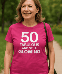 1. Bright pink birthday T-shirt with fun "50 Fabulous and Still Glowing" message for women.