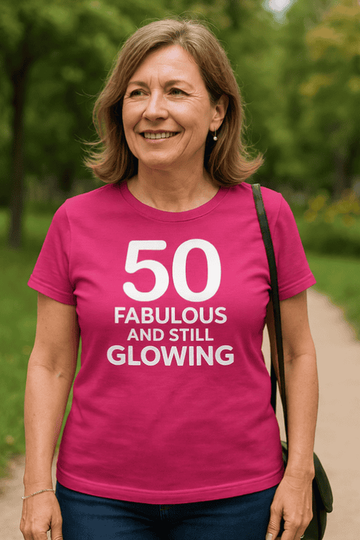 1. Bright pink birthday T-shirt with fun "50 Fabulous and Still Glowing" message for women.