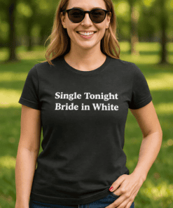 Cheerful woman wearing wedding-themed t-shirt outdoors, casual fashion, summer vibe.