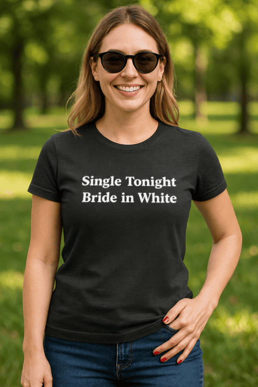 Cheerful woman wearing wedding-themed t-shirt outdoors, casual fashion, summer vibe.