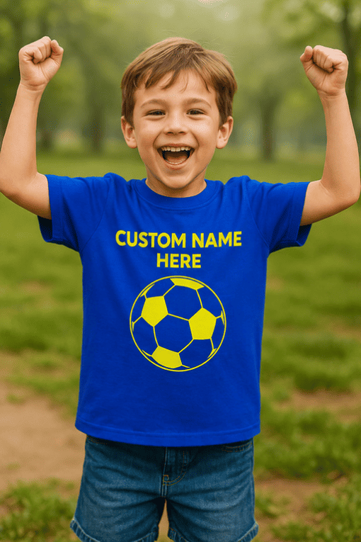 Happy young boy in soccer jersey showing victory sign outdoors, celebrating sports and team spirit.