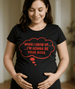 - Pregnant woman wearing humorous black T-shirt with red text saying "When I grow up... I'm gonna be your boss".