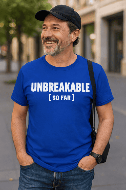 Unbreakable T-shirt, funny men's graphic tee, durable strength quote, casual streetwear, trendy summer outfit.