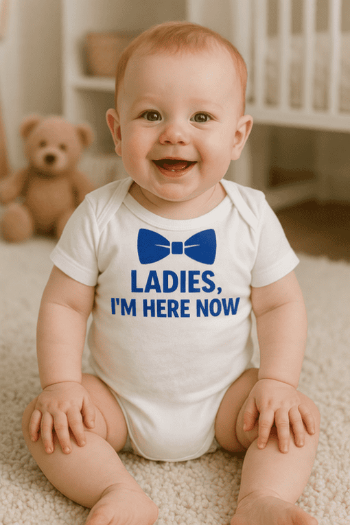 Cute baby in a "Ladies, I'm Here Now" T-shirt, ideal for kids' funny graphic tees, baby apparel, and gift shirts.