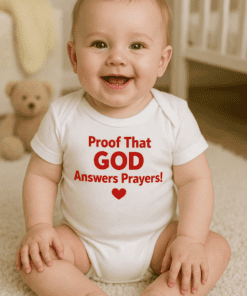 Cute baby in white onesie with religious message, proof that God answers prayers.