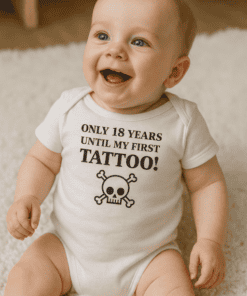 1. Baby smiling wearing "Only 18 Years Until My First Tattoo" onesie with skull graphic.