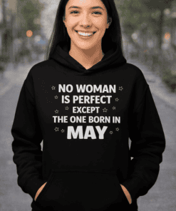 Bright woman smiling in black hoodie with May birthday quote, outdoor urban background, trendy women's fashion.
