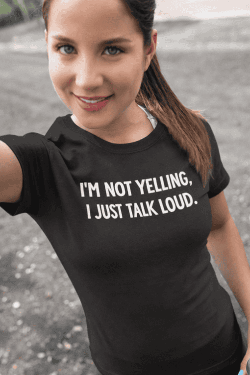 Pink t-shirt saying "I'M NOT YELLING, I JUST TALK LOUD" for casual or humorous fashion statements.