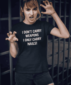 1. Woman in black t-shirt with "I DON’T CARRY WEAPONS, ONLY CARRY NAILS" text.