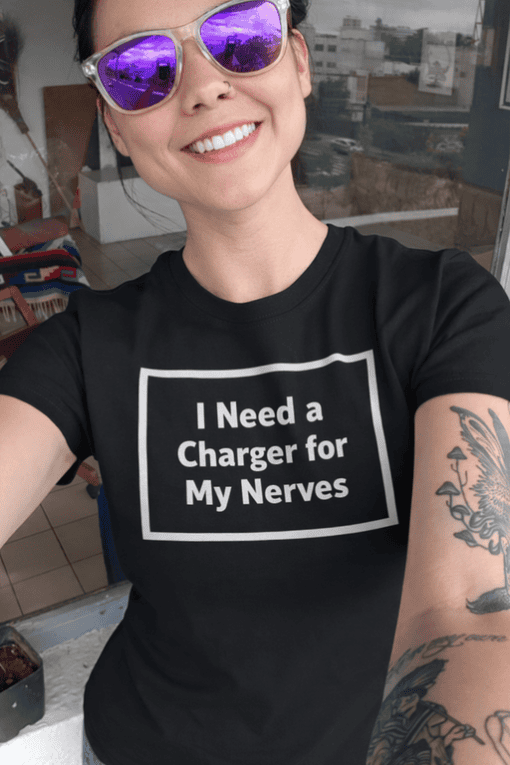 1. Funny graphic T-shirt with humorous quote about nerves and chargers.