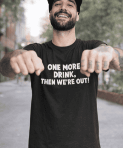 Funny black t-shirt with slogan for men and women lounging outdoors.