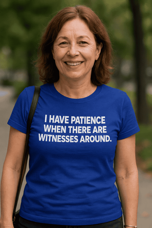1. Woman wearing blue humorous 'I have patience' T-shirt in outdoor park setting.