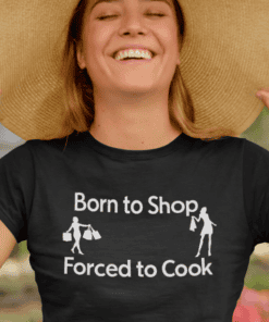 Bright smile woman wearing "Born to Shop, Forced to Cook" T-shirt, fashion for women, playful gift tee, casual trendy shirt for shopping lovers.
