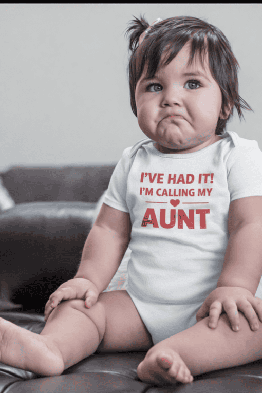 Cute baby with a funny sad face wearing a white T-shirt that says "I've had it! I'm calling my aunt".