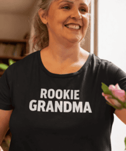 1. Woman wearing "Rookie Grandma" T-shirt, celebrating new grandma status.
