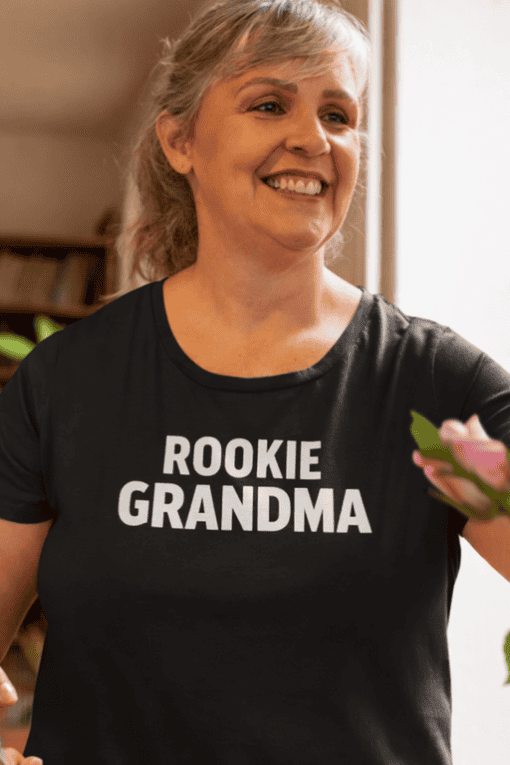 1. Woman wearing "Rookie Grandma" T-shirt, celebrating new grandma status.