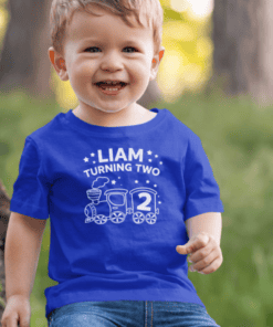 Happy birthday boy in personalized Liam turning two T-shirt, kids birthday celebration, fun toddler birthday outfit.