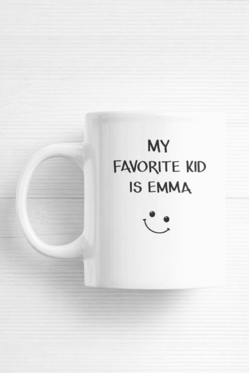 Cute kids' mug with "My favorite kid is Emma" and a smiley face design, perfect for personalized gifts.
