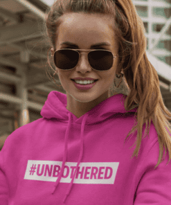 #1. Stylish pink hoodie with "#UNBOTHERED" slogan for women’s fashion and casual wear.