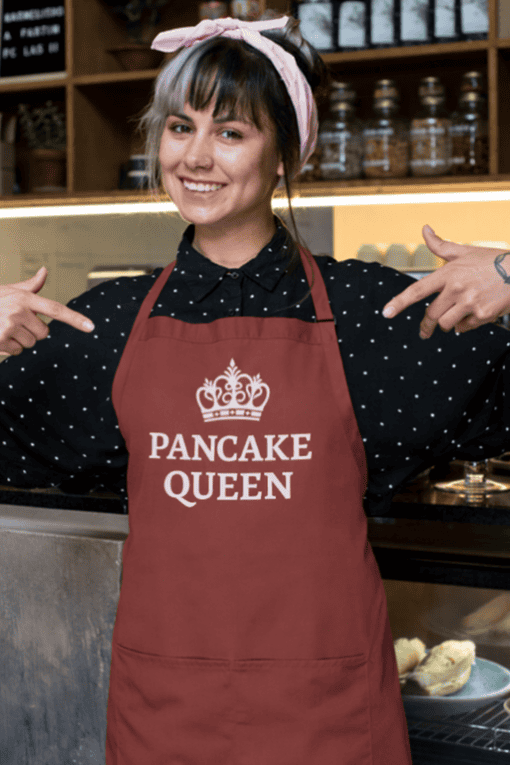 Delicious pancake queen apron with crown design, perfect for breakfast lovers and kitchen enthusiasts.
