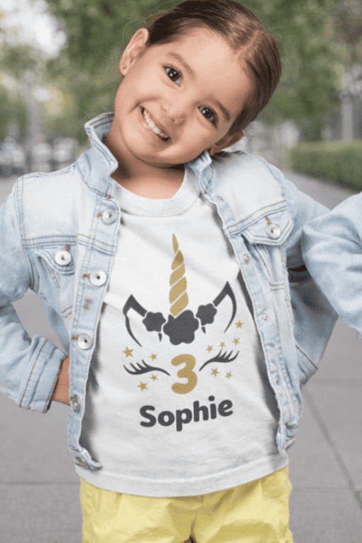 Unicorn birthday girl t-shirt with personalized unicorn design, name, age, and stars for kids.