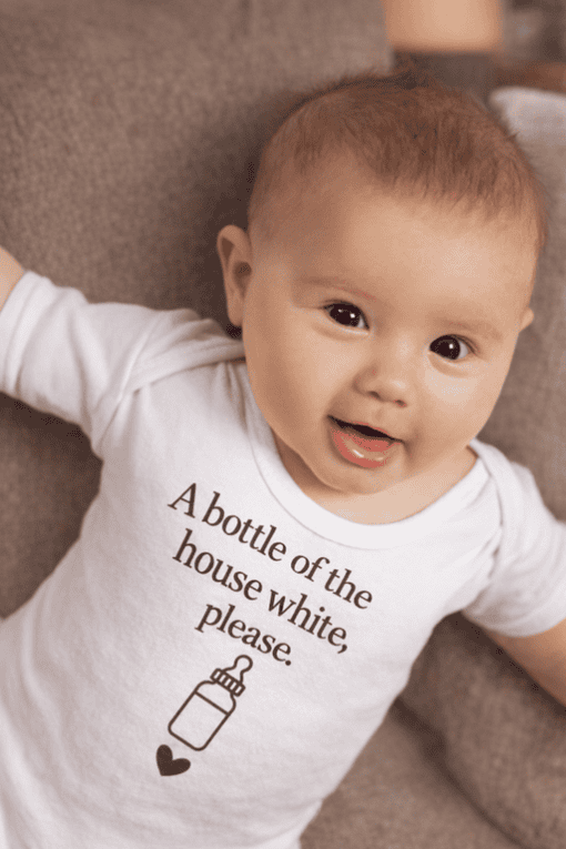 Baby T-shirt with humorous phrase and baby bottle graphic, perfect for cute, funny baby clothing.