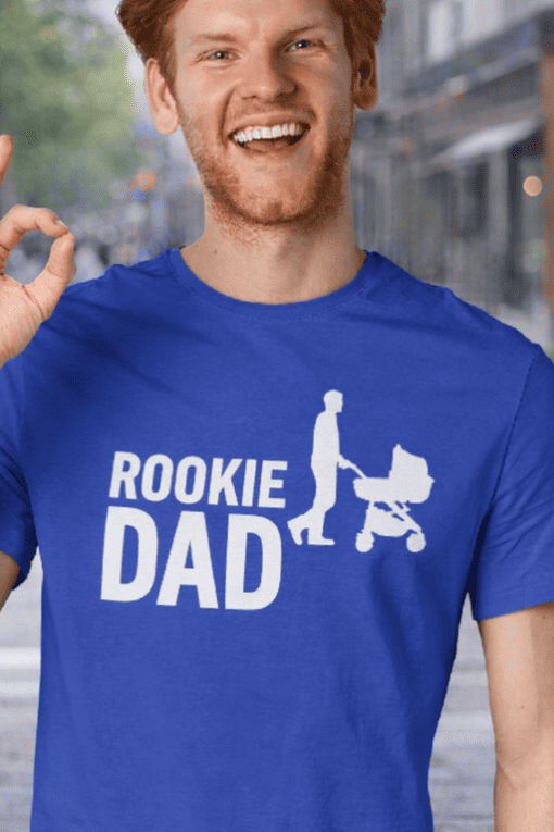 Cute rookie dad t-shirt with stroller graphic for new fathers, perfect casual wear for dads.