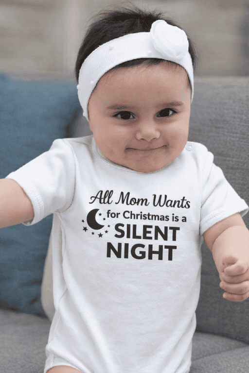 Cute baby girl wearing Christmas T-shirt with humorous message about silent night, perfect for holiday gift ideas.