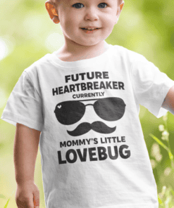 Cute boy wearing humorous "Future Heartbreaker" T-shirt with sunglasses and mustache design.
