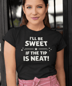 Smiling woman wearing black graphic t-shirt with humorous quote, casual fashion, trendy tee.