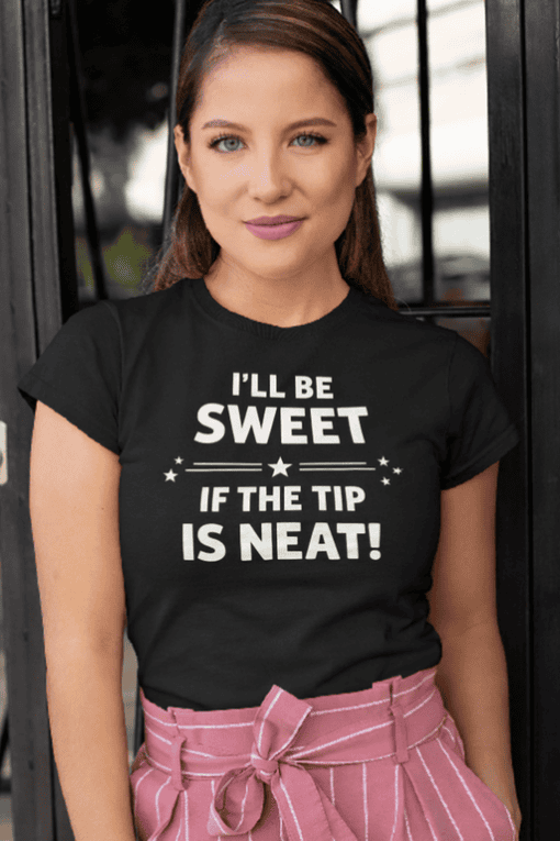Smiling woman wearing black graphic t-shirt with humorous quote, casual fashion, trendy tee.