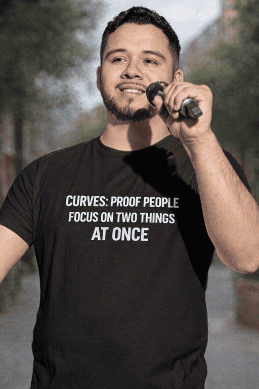 Bold black T-shirt with humorous quote about curves and focus. Perfect for casual wear and making a statement.