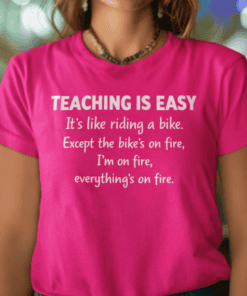 Vibrant pink teaching t-shirt with humorous quote about effortless teaching and being on fire. Perfect for teachers and educators.