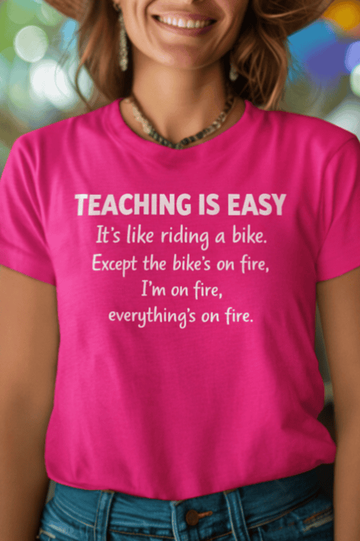 Vibrant pink teaching t-shirt with humorous quote about effortless teaching and being on fire. Perfect for teachers and educators.